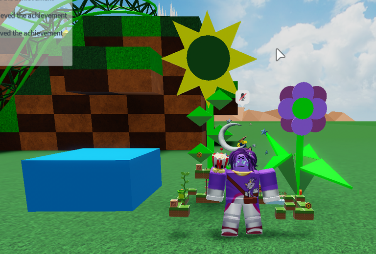 Me with large flower props and cerulean block