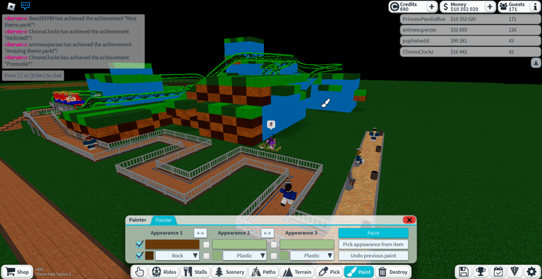 Me in process of painting brown checkerboard pattern on Green Hill Zone ride landscape base