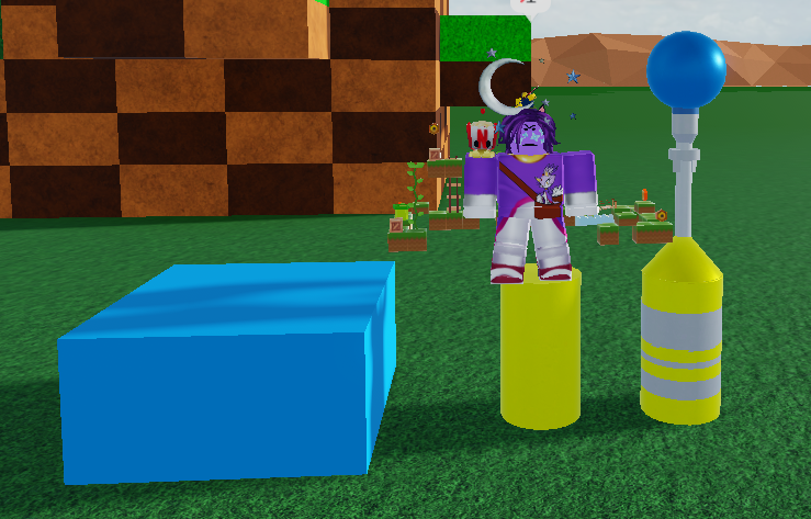 Me standing on yellow cylinder besides finished Star Post, besides a cerulean block