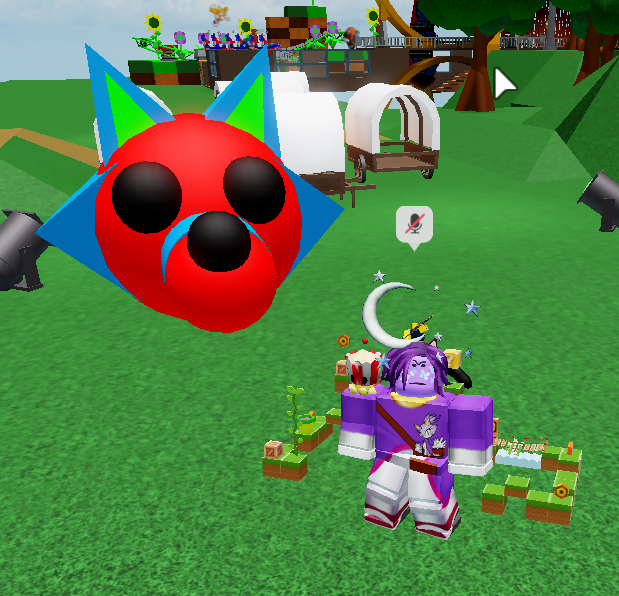 Me with head of wolf prop with parts colored red, cerulean, and green